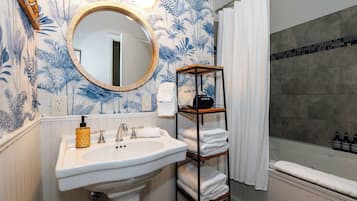 Shower, hair dryer, towels, shampoo