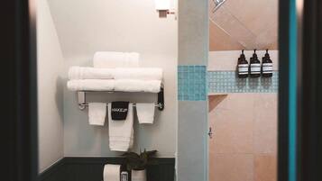 Shower, hair dryer, towels, shampoo
