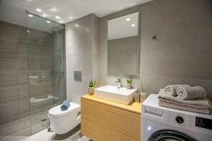 Shower, hair dryer, towels, soap
