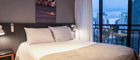 Desk, laptop workspace, blackout curtains, travel cot