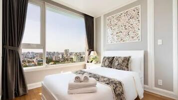 Family Apartment, Balcony, City View | In-room safe, desk, laptop workspace, blackout drapes