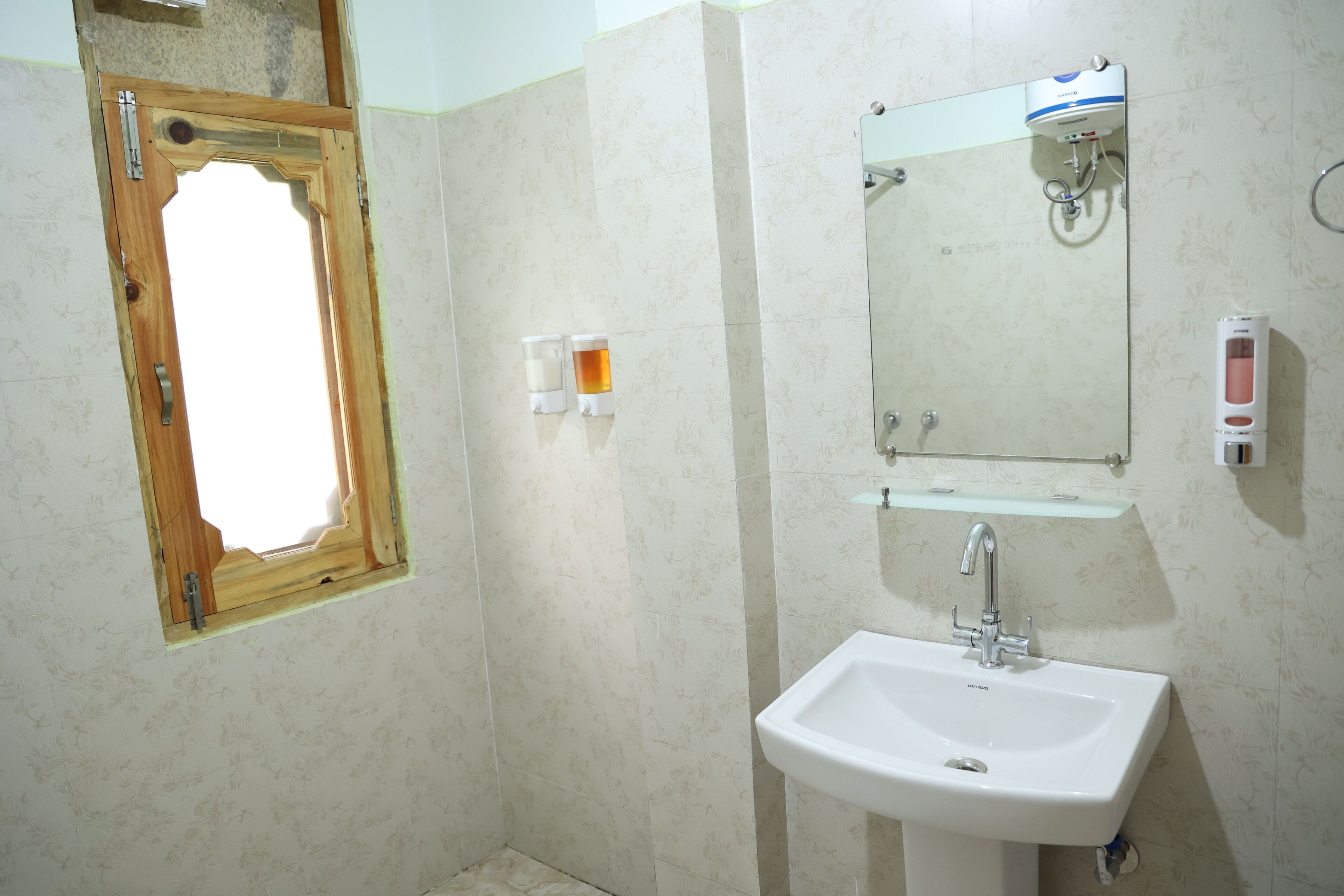 Family Quadruple Room, Courtyard View | Bathroom | Shower, slippers, towels, soap