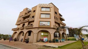 A multi-story building with balconies and a sign for 'ZIARA TOWER'. - Hotel Dream Heights Hotel and Apartment (Rawalpindi)