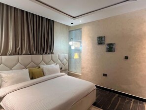 Family Apartment, Balcony, City View | 3 bedrooms, desk, laptop workspace, iron/ironing board - Castle Estate Apartments (Abuja)