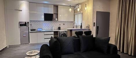 Familienapartment, Balkon, Stadtblick | Wohnbereich