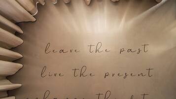 A handwritten message on a beige background with a light source creating a glow effect.