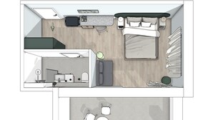 Ein Schlafzimmer mit Bett, Nachttischen und einem Fenster. Der Raum hat einen Holzboden und eine weiße Decke.