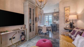 Condo, Balcony, City View | Living area | 32-inch flat-screen TV with cable channels