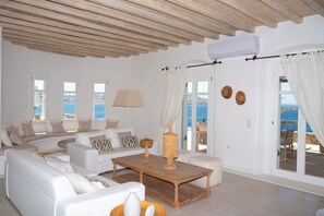 TOPOS MYKONOS KYMOTHOE VILLA | Living area | TV