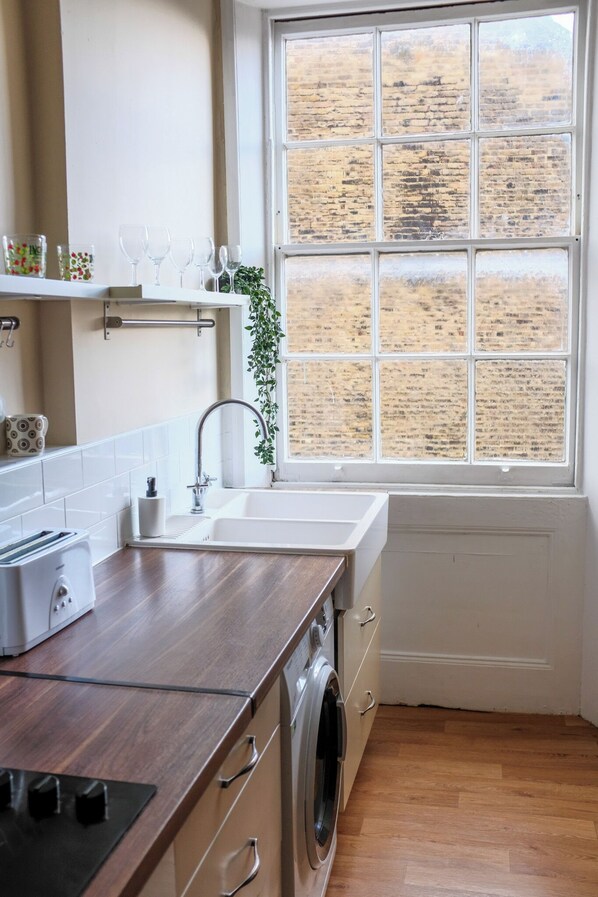 Fridge, oven, toaster, dining tables