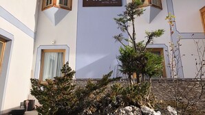 A hotel facade with a prominent sign reading "nuis HOTEL & SPA". - Nivis Hotel  (Dimaro Folgarida)