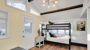A room with a bunk bed, a desk, a chair, and a window with a view. - Luxury Boston Ranch –Sleeps 8|Pet+|Heated pool (Framingham)