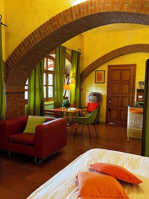 Junior Apartment, Partial Sea View | Living area | Fireplace, table tennis, books - Relais San Damian (Imperia)