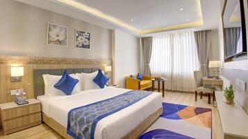 Family Suite, City View | 1 bedroom, in-room safe, desk, laptop workspace