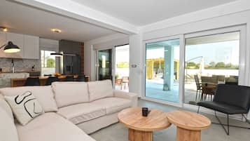 Villa (Four Bedroom Villa with Pool) | Living room | 32-inch flat-screen TV with satellite channels