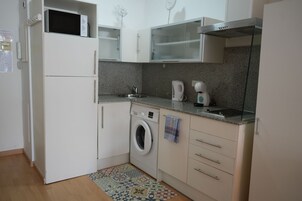 Comfort Apartment | Private kitchen | Fridge, microwave, stovetop, dishwasher