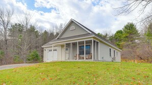 A single-story house with a gabled roof, a covered porch, and a front door. - Ski, Hike & Boat: Modern Bridgton Retreat (Bridgton)