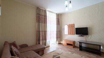 Desk, laptop workspace, blackout curtains, iron/ironing board