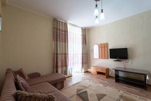 Desk, laptop workspace, blackout drapes, iron/ironing board