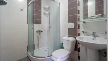Shower, hair dryer, slippers, towels