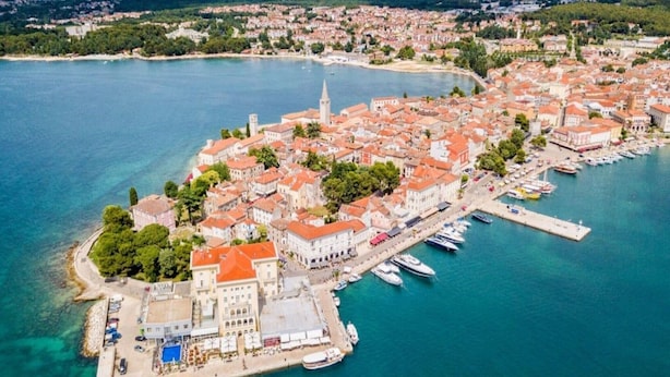 An aerial view of a coastal town with a marina, historic buildings, and a prominent church tower. - Welcoming Apartment With Garden (Porec)