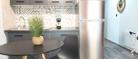 Fridge, microwave, stovetop, coffee/tea maker