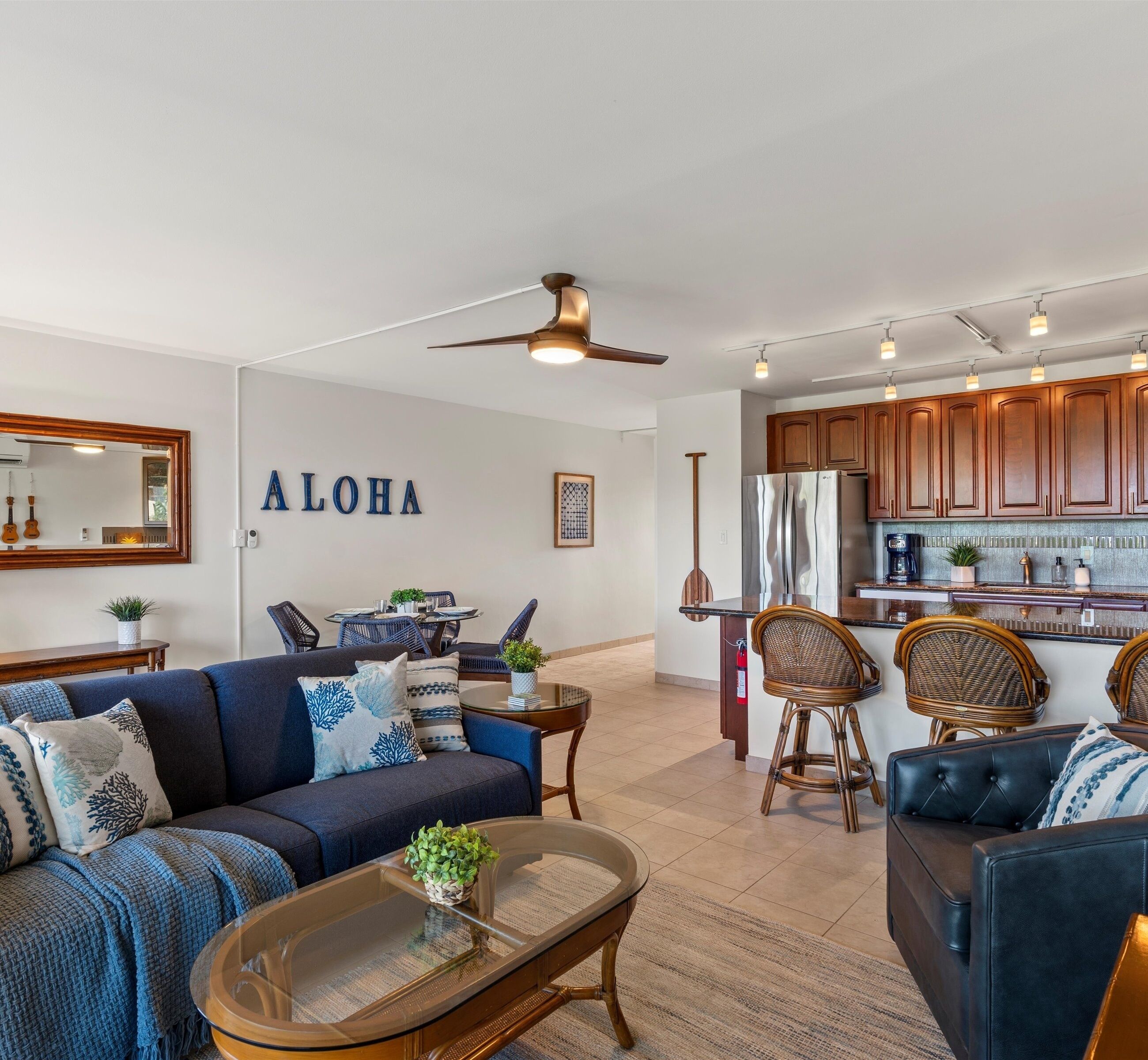 A modern living room with a sofa, coffee table, and dining area.