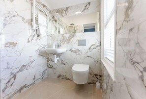 Shower, eco-friendly toiletries, hair dryer, towels