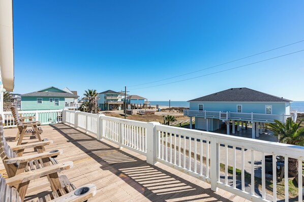 Relax on the beachfront deck with lounge chairs and enjoy the scenic ocean view.