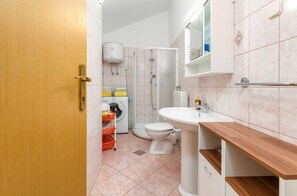 Shower, hair dryer, towels, toilet paper