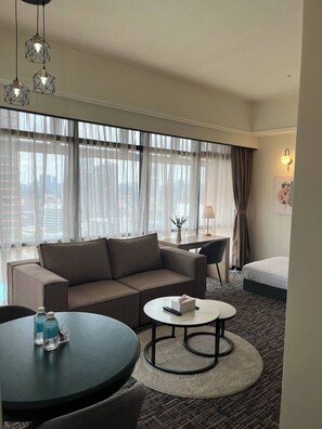 Superior Room | Living area | 32-inch flat-screen TV with cable channels - TAHEEENS SUITE at BERJAYA TIMES SQUARE (Kuala Lumpur)