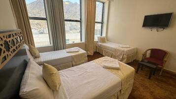 Economy Triple Room | Iron/ironing board, free WiFi