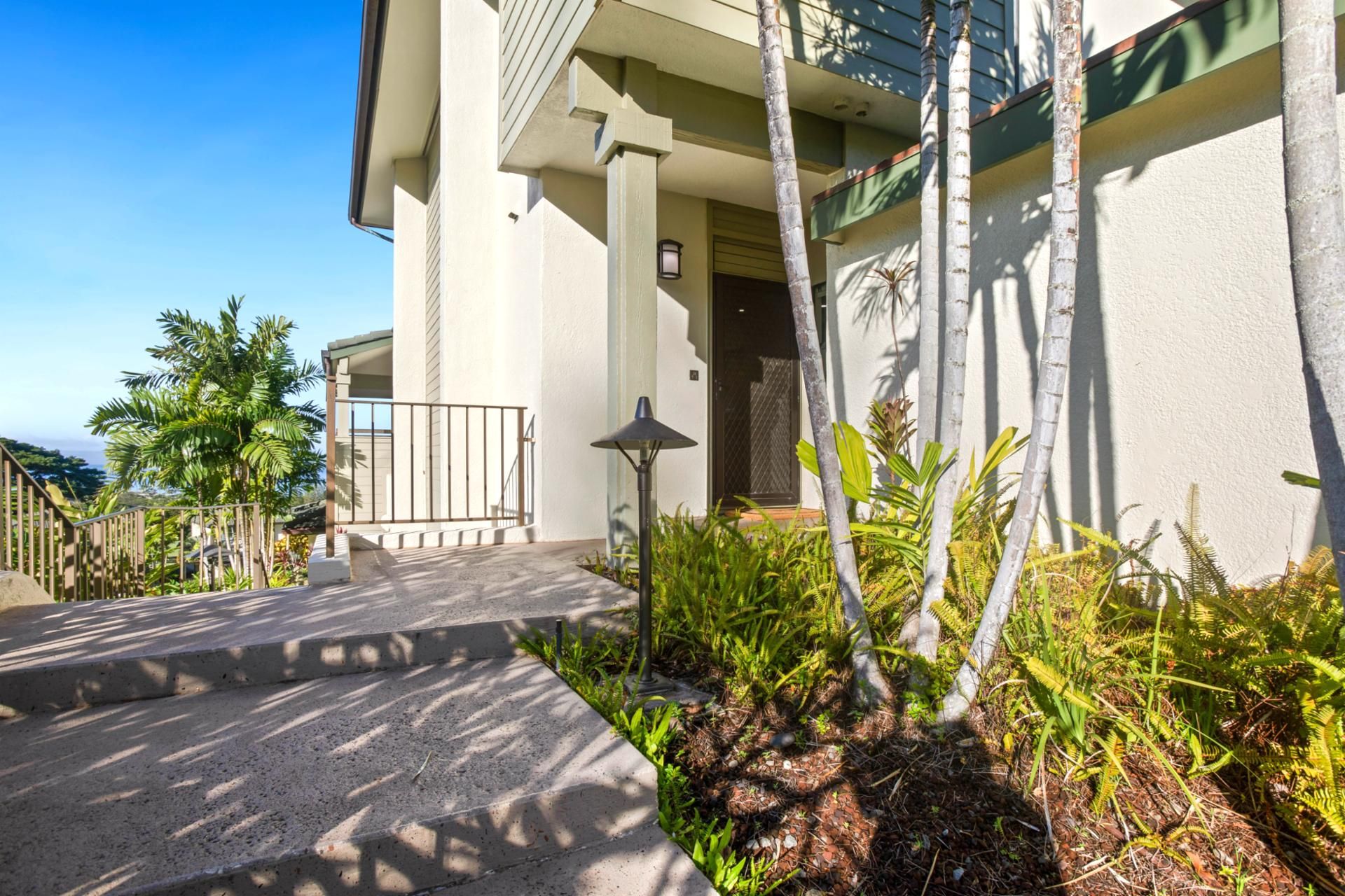 Framed by palms and island flora, this serene entrance welcomes you to a peaceful Kapalua escape like no other  