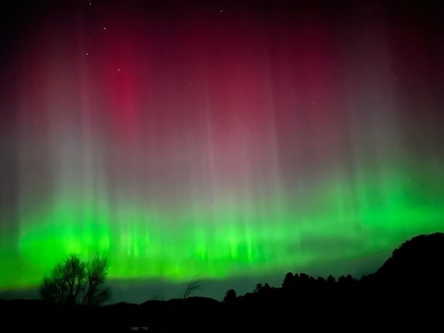 A night sky with the aurora borealis.