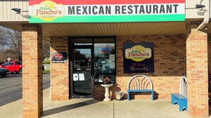 A Mexican restaurant with a brick facade, a signboard, and a welcoming bench outside. - Near Canton 3-bedroom house in  Louisville with WiFi, patio  (Louisville)