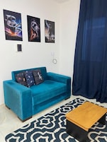 Apartamento, 1 habitación, cocina | Zona de estar | Una Smart TV