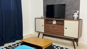 Apartamento, 1 quarto, cozinha | Área de estar | Smart TV