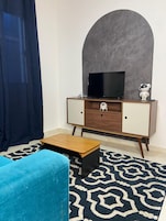 Apartamento, 1 habitación, cocina | Zona de estar | Una Smart TV