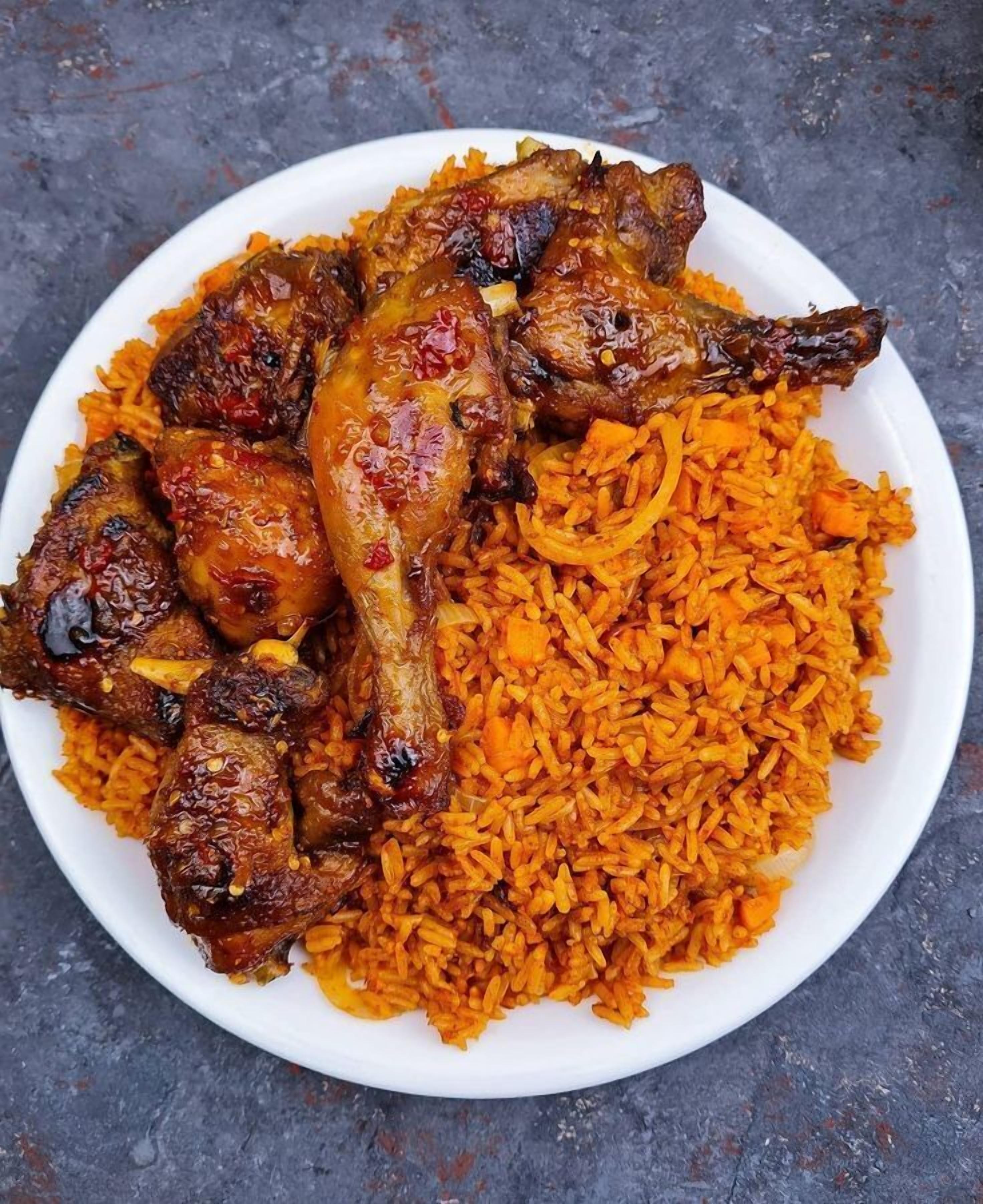 A plate of grilled chicken and rice.