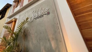 A modern hotel facade with a prominent sign reading "Sabbia LD HOTELES". - Sabbia By LD Hoteles (Los Roques)