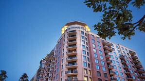 A high-rise building with a prominent sign reading "WYNDHAM" at the top.