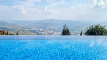 Outdoor pool, free pool cabanas, pool umbrellas