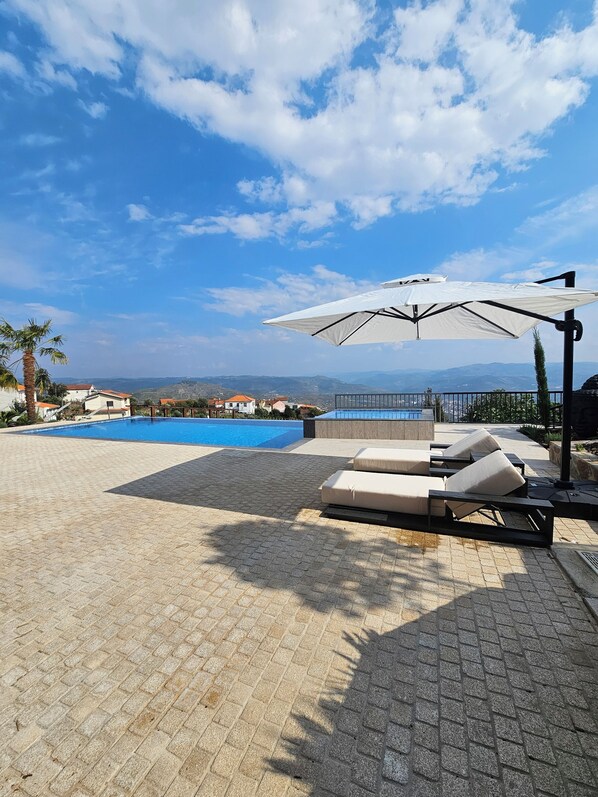 Outdoor pool, free pool cabanas, pool umbrellas