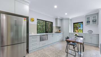 Fridge, stovetop, dishwasher, coffee/tea maker