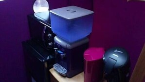 A small kitchenette with a coffee maker, a microwave, and a toaster on a wooden countertop. - La Bulle Des Anges (Dormir à la belle étoile) (Illoud)