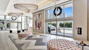 A spacious lobby with large windows, a modern chandelier, and a large wreath decoration. - High-Floor High-Class: Luxury Oceanview,NO RESORT & PARKING FEE, CHECK DETAILS (Hollywood)