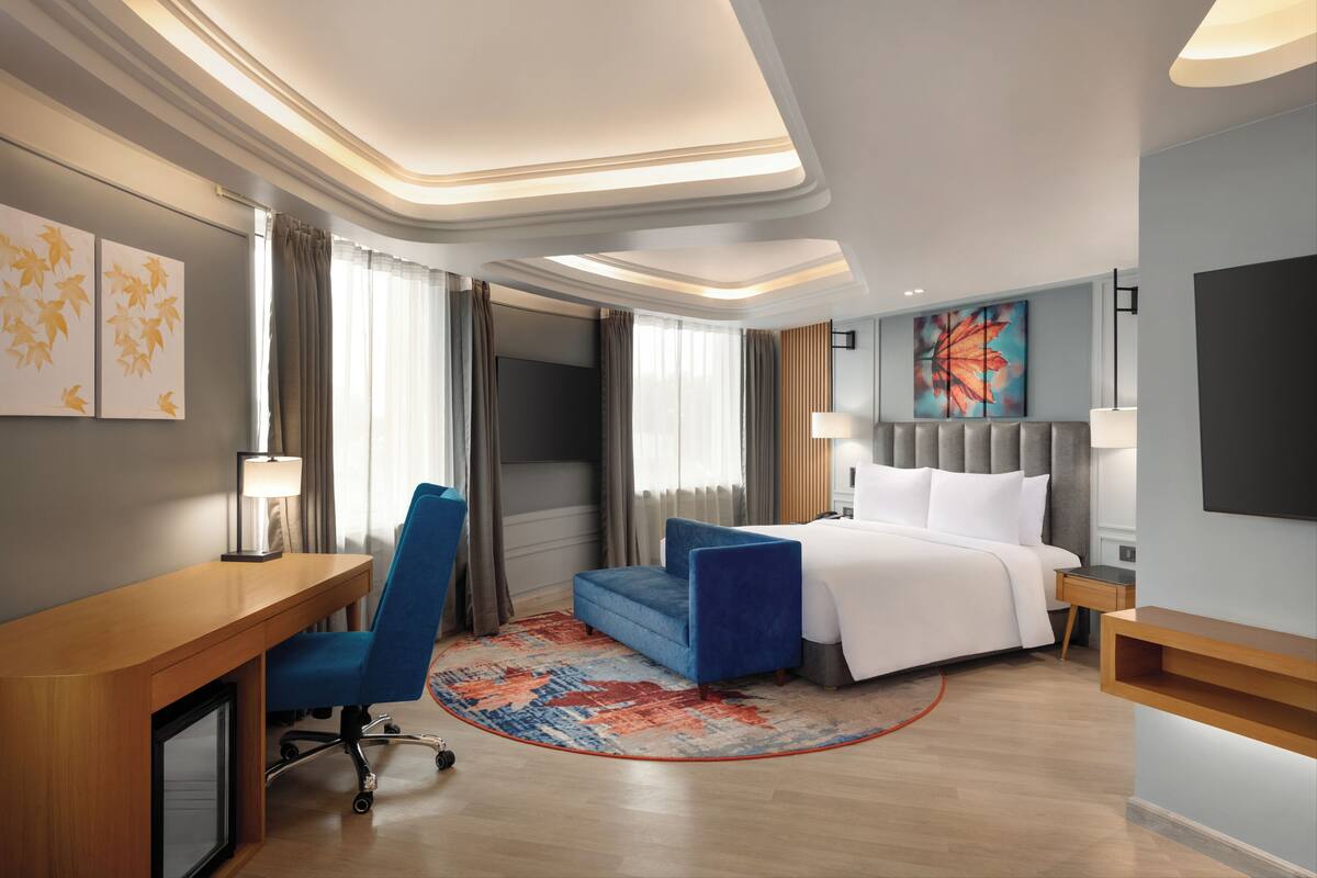 Premium Suite, 1 King Bed, City View | Hypo-allergenic bedding available, down comforters, in-room safe, desk