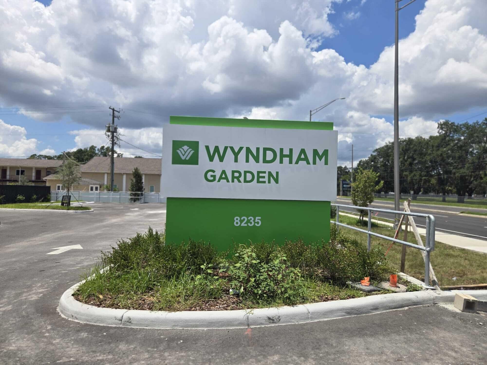 A sign for Wyndham Garden with the address 8235.