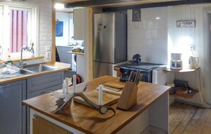 Fridge, stovetop, dishwasher, coffee/tea maker