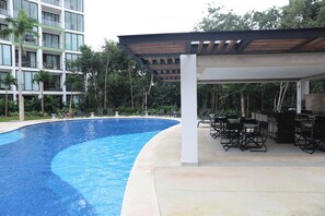 2 outdoor pools, open 8:00 AM to 9:00 PM, pool umbrellas, pool loungers